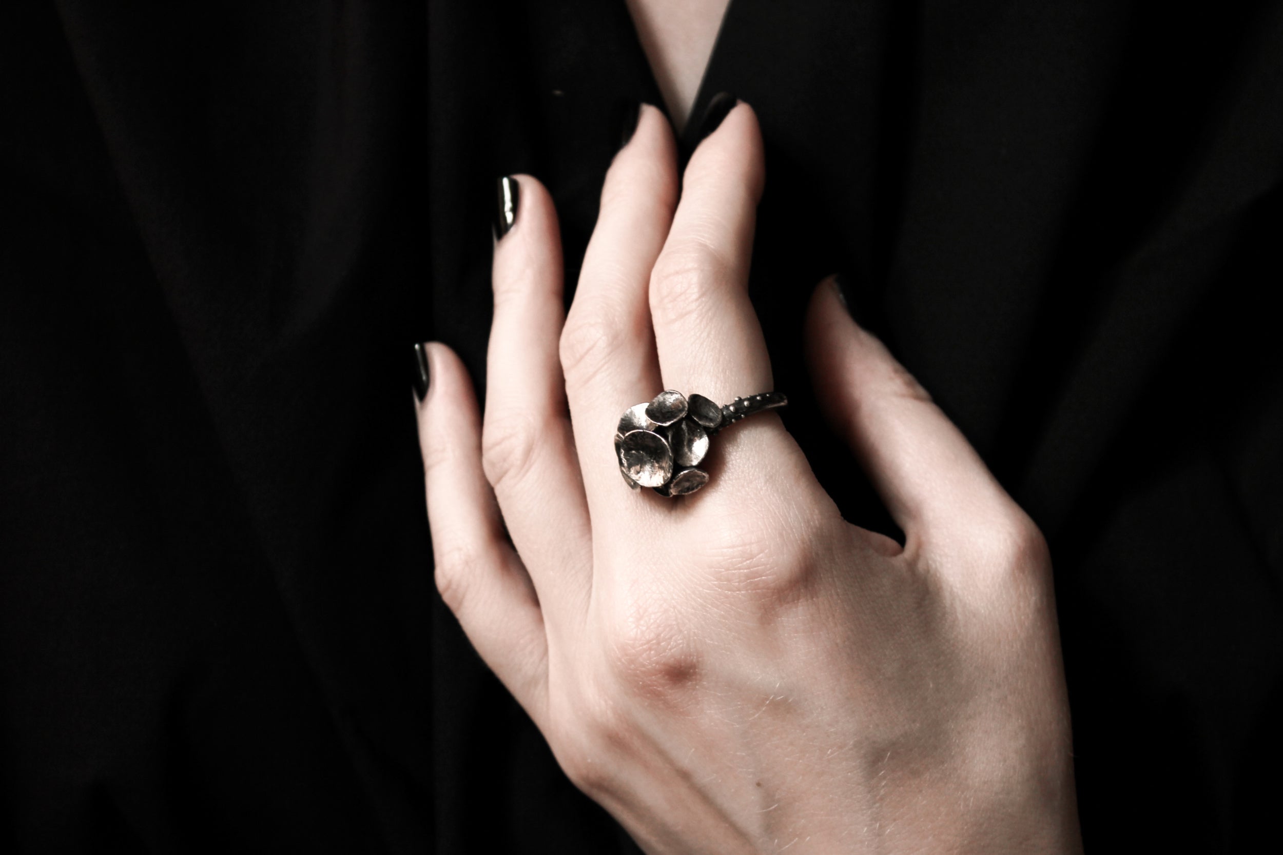 Handcrafted detailed oxidised silver mushroom ring number 7 on a model - Natt Jewellery