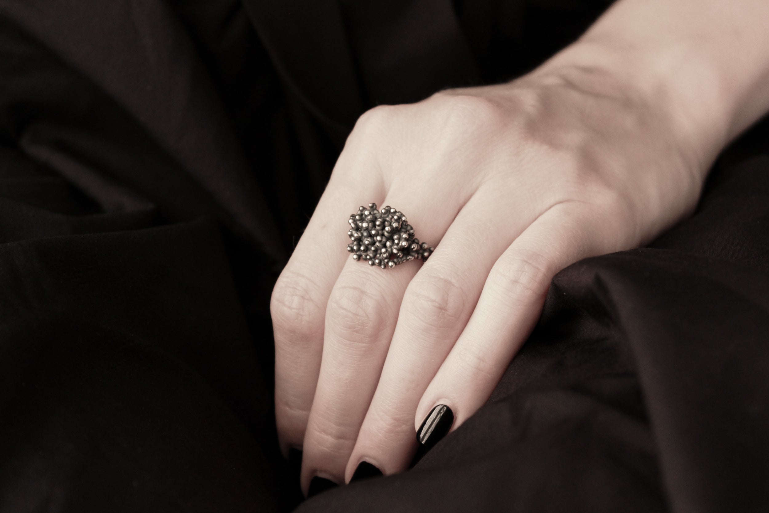 Handcrafted oxidised solid silver droplets ring number4 on a model - Natt Jewellery