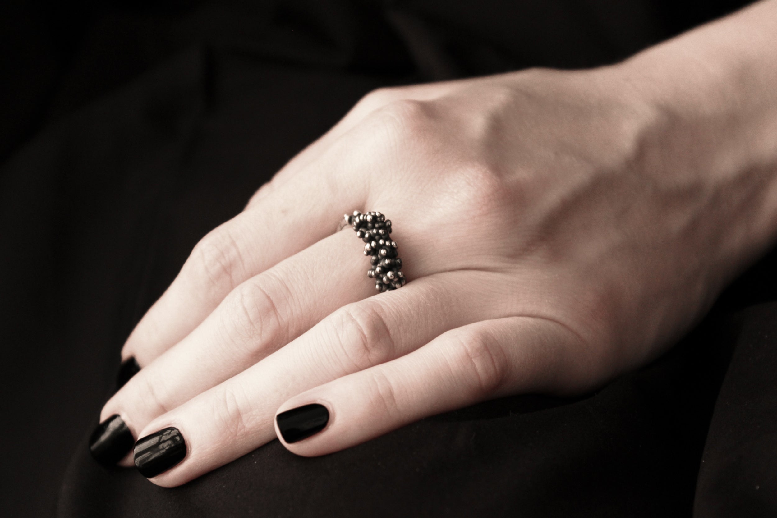 Handcrafted oxidised solid sterling silver droplets ring number 2 on a model - Natt Jewellery