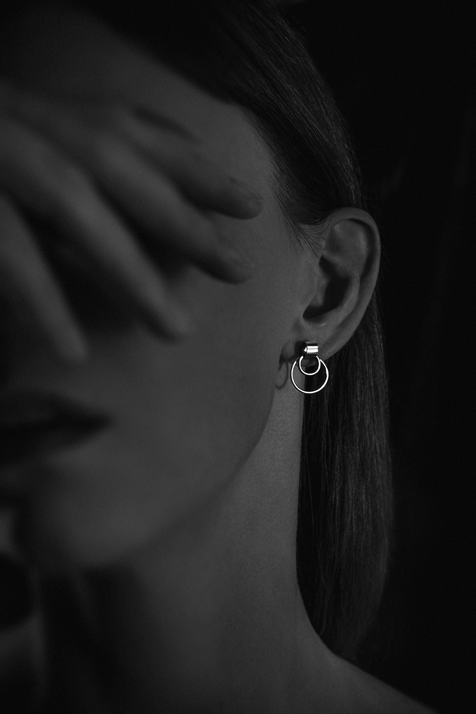 Handcrafted solid sterling silver choker earrings on a model - Natt Jewellery